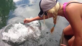 Hand feeding Barramundi at Howard Springs Nature Park Northern Territory