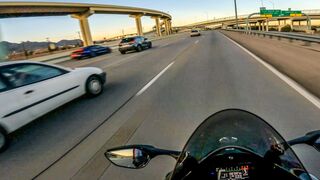ZX10R zooms away from mustang squad car on the highway