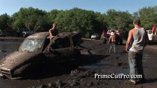 Truck Stuck in Mud Gets Pulled Out